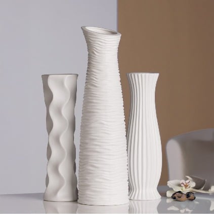 White ceramic Gilde Wave Vase, 34cm tall, with a modern wave design and smooth finish, perfect for decorative floral arrangements.