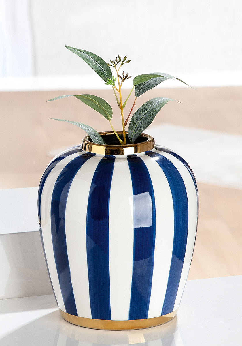Blue and white Gilde Bulbous Elio striped ceramic vase with a rounded shape and decorative pattern.