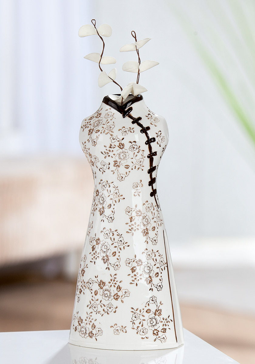 White ceramic Gilde vase with Sakura flower motif, 24cm tall, featuring elegant floral design.