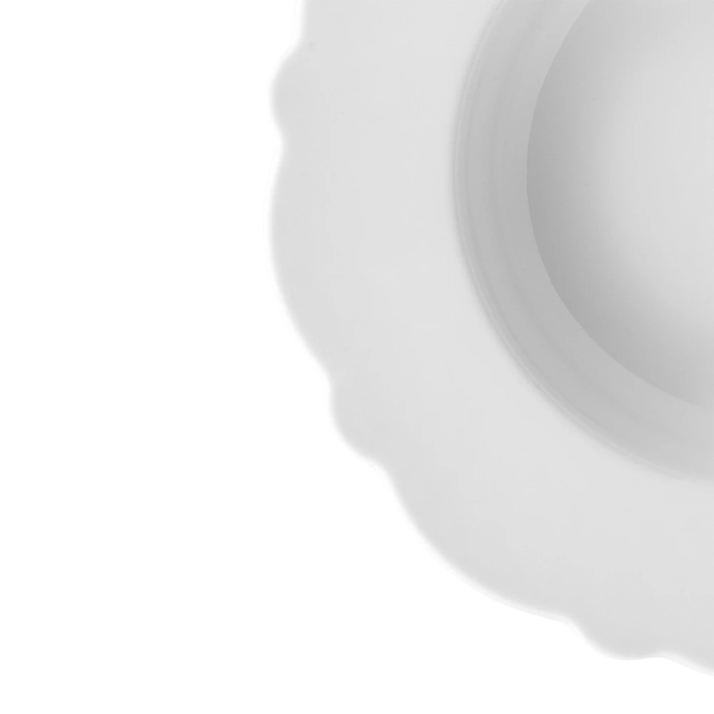 Alessi dressed porcelain soup bowl with a decorative design, shown from a side angle on a neutral background.