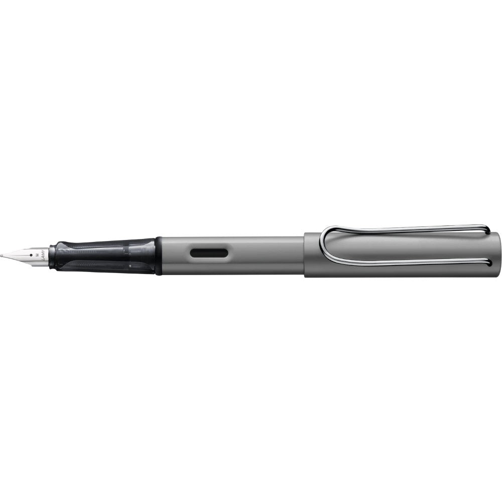 Lamy AL-star fountain pen with silver aluminum body and blue ink nib, displayed on a white background.
