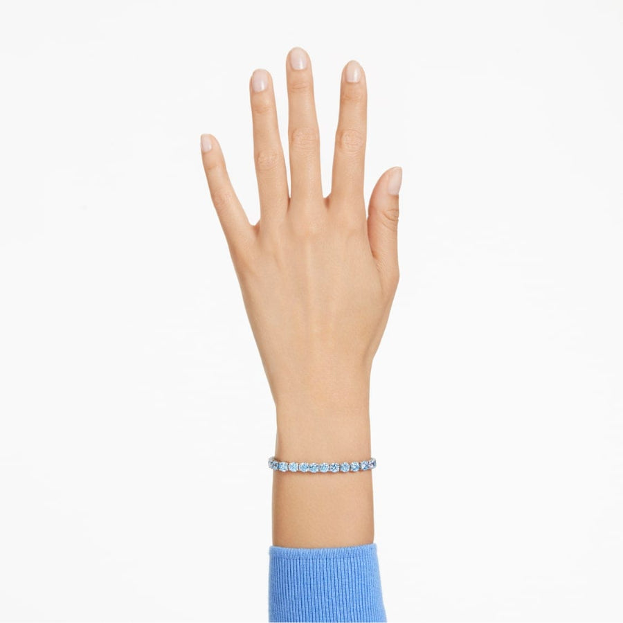 Swarovski Matrix Tennis Bracelet with round cut crystals, elegant jewelry piece showcasing sparkling design and polished silver finish.