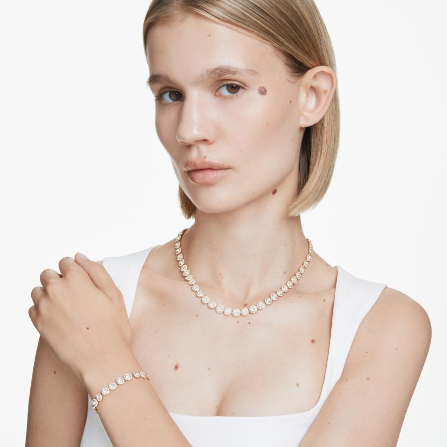 Swarovski Una Angelic set featuring a round cut white crystal pendant and matching earrings in gold-tone plating.